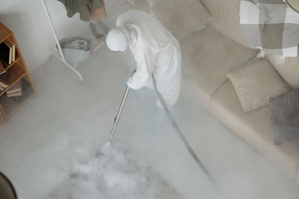 Biohazard cleanup technician in protective equipment, Grandview Heights, Wichita, KS